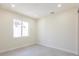 Bright, airy bedroom with large window, neutral walls, tile floor, and modern finishes at 5316 Altoona St, Sarasota, FL 34232