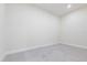 A vacant bedroom features neutral paint, tile flooring, and baseboards at 5316 Altoona St, Sarasota, FL 34232