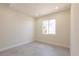 Bright bedroom featuring a large window, neutral walls, and tile floors with modern finishes at 5316 Altoona St, Sarasota, FL 34232