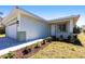 A welcoming home exterior with a lush garden bed, showcasing meticulous lawn care and modern design at 5316 Altoona St, Sarasota, FL 34232