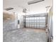 Spacious garage with an automatic door opener and concrete flooring at 5316 Altoona St, Sarasota, FL 34232
