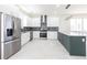 Spacious kitchen features stainless steel appliances, custom cabinets, granite countertops and a center island at 5316 Altoona St, Sarasota, FL 34232