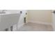 Laundry room featuring a utility sink and connections for a washer and dryer at 5316 Altoona St, Sarasota, FL 34232