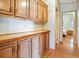 Bright kitchen features ample cabinetry and a breakfast bar at 35935 Tanda Cir, Zephyrhills, FL 33541