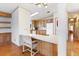 Kitchen with breakfast bar and wood cabinets at 35935 Tanda Cir, Zephyrhills, FL 33541