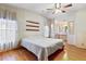 Main bedroom with hardwood floors and ensuite bathroom access at 35935 Tanda Cir, Zephyrhills, FL 33541