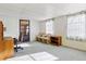 Home office with built-in shelving and window light at 35935 Tanda Cir, Zephyrhills, FL 33541