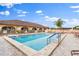 Community pool with plenty of lounge chairs at 35935 Tanda Cir, Zephyrhills, FL 33541