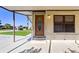 Front entrance of a home with a covered porch at 35935 Tanda Cir, Zephyrhills, FL 33541