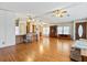 Large living area with hardwood floors and views to kitchen at 35935 Tanda Cir, Zephyrhills, FL 33541