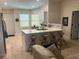 Island kitchen with seating and modern finishes at 3529 65Th Avenue E Cir, Sarasota, FL 34243