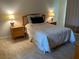 Cozy bedroom with double bed and nightstands at 3529 65Th Avenue E Cir, Sarasota, FL 34243
