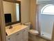 Clean bathroom with single vanity, toilet, and shower at 3529 65Th Avenue E Cir, Sarasota, FL 34243