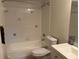 Bathroom with tub, toilet, and decorative tile at 3529 65Th Avenue E Cir, Sarasota, FL 34243