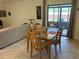 Bright dining area with table and chairs, near living room at 3529 65Th Avenue E Cir, Sarasota, FL 34243