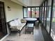 Relax in the screened patio with hot tub and seating area at 3529 65Th Avenue E Cir, Sarasota, FL 34243