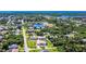 Aerial view of a house nestled in a neighborhood with water access nearby at 18065 Wing Ave, Port Charlotte, FL 33948