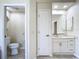Bathroom with a toilet, sink and vanity, and additional storage at 18065 Wing Ave, Port Charlotte, FL 33948