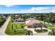 Aerial view of a single-Gathering home with a large backyard and pool at 18065 Wing Ave, Port Charlotte, FL 33948