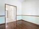 Bedroom with hardwood floors, an archway, and views into another room at 18065 Wing Ave, Port Charlotte, FL 33948