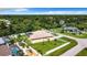 Aerial view showing a house with a large backyard, pool, and playground at 18065 Wing Ave, Port Charlotte, FL 33948
