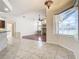 Open living room with hardwood floors, built-in shelving, and fireplace at 18065 Wing Ave, Port Charlotte, FL 33948