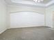 Large Primary bedroom with carpet floors and arched wall detail at 18065 Wing Ave, Port Charlotte, FL 33948