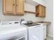 Laundry room with washer, dryer, and cabinets at 18065 Wing Ave, Port Charlotte, FL 33948