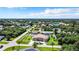 Aerial view of a house in a residential neighborhood at 18065 Wing Ave, Port Charlotte, FL 33948