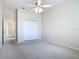 Bright bedroom with ceiling fan and spacious closet at 18065 Wing Ave, Port Charlotte, FL 33948