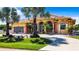 Charming single-Gathering home with lush landscaping and palm trees at 18065 Wing Ave, Port Charlotte, FL 33948