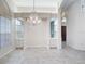 Spacious dining room, featuring a chandelier and built-in hutch at 18065 Wing Ave, Port Charlotte, FL 33948