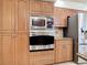 Well-equipped kitchen featuring stainless steel appliances and wood cabinets at 18065 Wing Ave, Port Charlotte, FL 33948