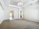Spacious Primary bedroom with plush carpeting and a chandelier at 18065 Wing Ave, Port Charlotte, FL 33948
