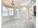 Bright breakfast nook with tile floors and view of the pool and lanai at 18065 Wing Ave, Port Charlotte, FL 33948