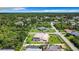 Aerial view of a single-Gathering home with pool, located in a residential neighborhood at 18065 Wing Ave, Port Charlotte, FL 33948