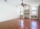 Living room with hardwood floors, built-in shelving and fireplace at 18065 Wing Ave, Port Charlotte, FL 33948