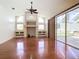 Living room with hardwood floors, built-in shelving, and fireplace at 18065 Wing Ave, Port Charlotte, FL 33948