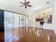 Spacious living room with hardwood floors and sliding doors to the lanai at 18065 Wing Ave, Port Charlotte, FL 33948