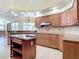 Kitchen boasts granite countertops, stainless steel appliances, and an island at 18065 Wing Ave, Port Charlotte, FL 33948