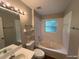 Bathroom with a tub shower combo, toilet and vanity at 6115 Sand Key Ln, Wesley Chapel, FL 33545