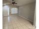 Spacious living room with tile flooring and neutral wall colors at 6115 Sand Key Ln, Wesley Chapel, FL 33545