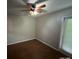 Bedroom with wood-look flooring and sliding glass doors at 6115 Sand Key Ln, Wesley Chapel, FL 33545