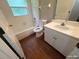 Clean bathroom with a tub shower combo, toilet and vanity at 6115 Sand Key Ln, Wesley Chapel, FL 33545