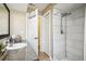 Bathroom with granite countertop, large shower, and linen closet at 12377 Fillmore St, Spring Hill, FL 34609