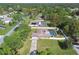 Aerial view of two homes with pools in a lush, tree-lined neighborhood at 12377 Fillmore St, Spring Hill, FL 34609