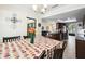 Dining room with table for six, view of kitchen and Gathering room at 12377 Fillmore St, Spring Hill, FL 34609