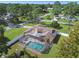 Aerial view of home with a fenced-in pool and a large backyard at 12377 Fillmore St, Spring Hill, FL 34609