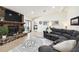 Living room with stone fireplace and access to backyard at 12377 Fillmore St, Spring Hill, FL 34609