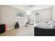 Bright bedroom with a daybed, exercise equipment, and backyard access at 12377 Fillmore St, Spring Hill, FL 34609